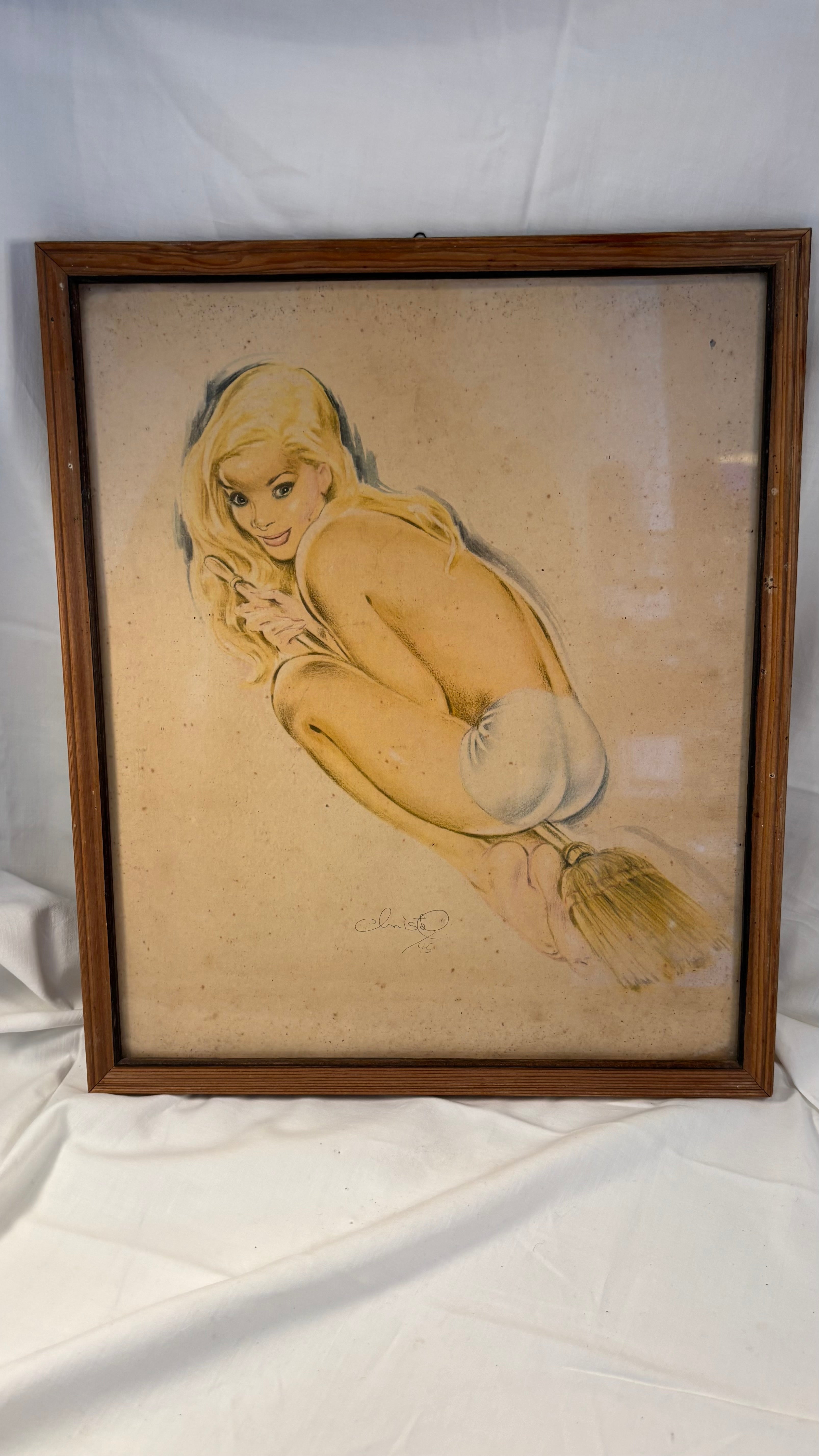 Vintage pin-up billede af pige på kosteskaft